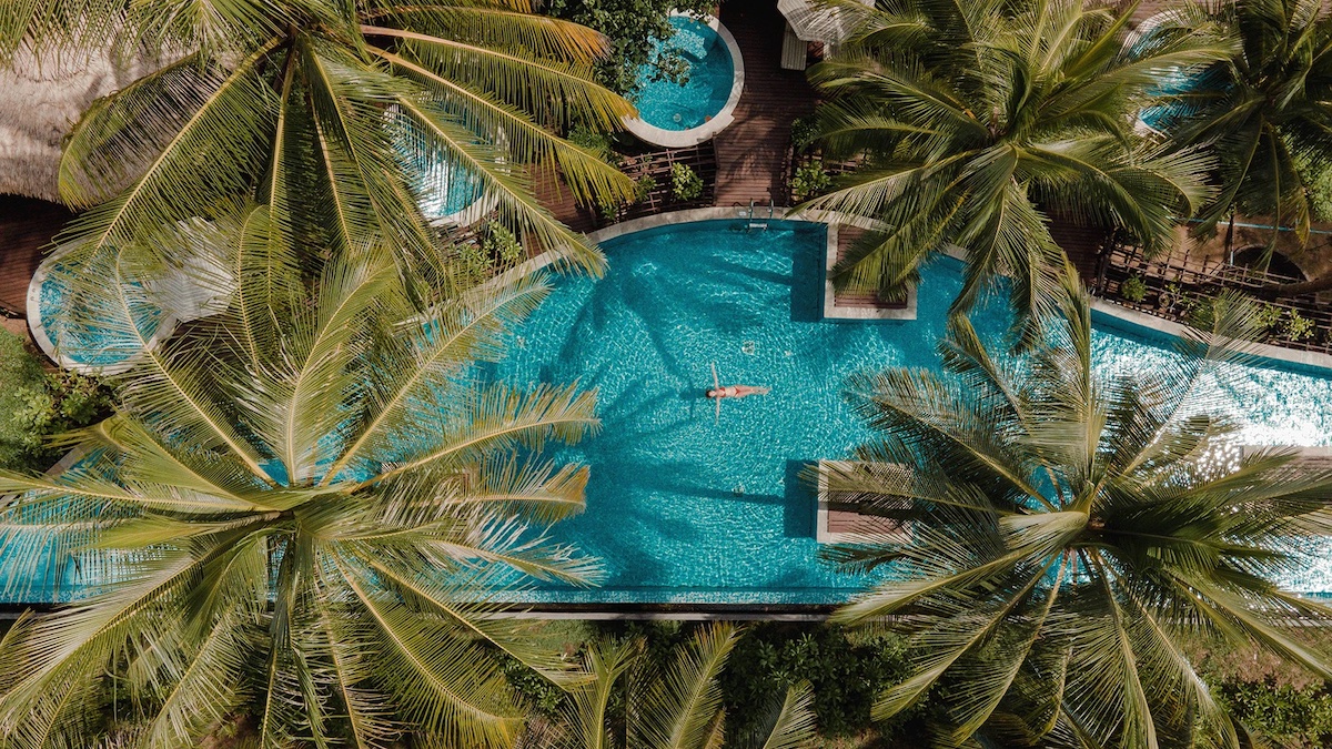 An aerial of a woman in the pool at The Haven Khao Lak - Luxury Escapes