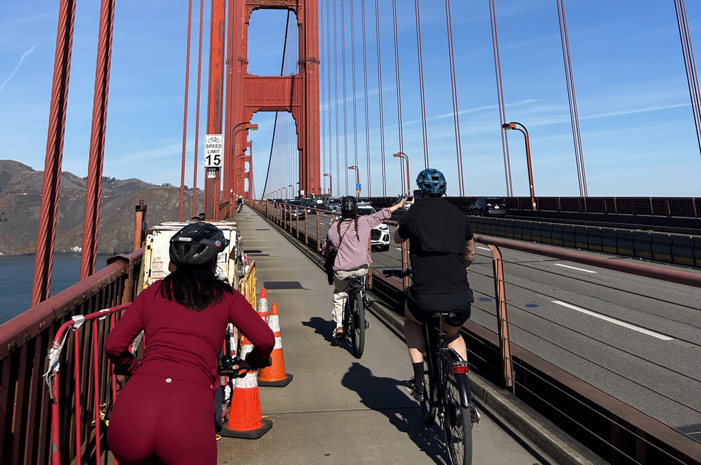 Biking across the Golden Gate Bridge in San Francisco, one of the best things to do in California - Luxury Escapes