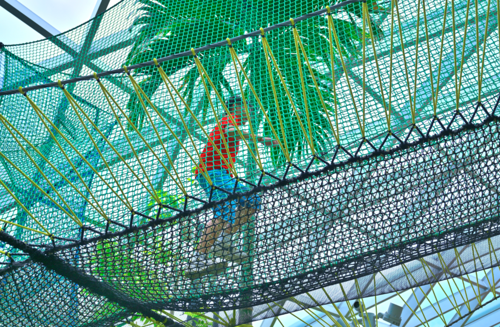 Boy using the walking net at Jewel Changi Airport