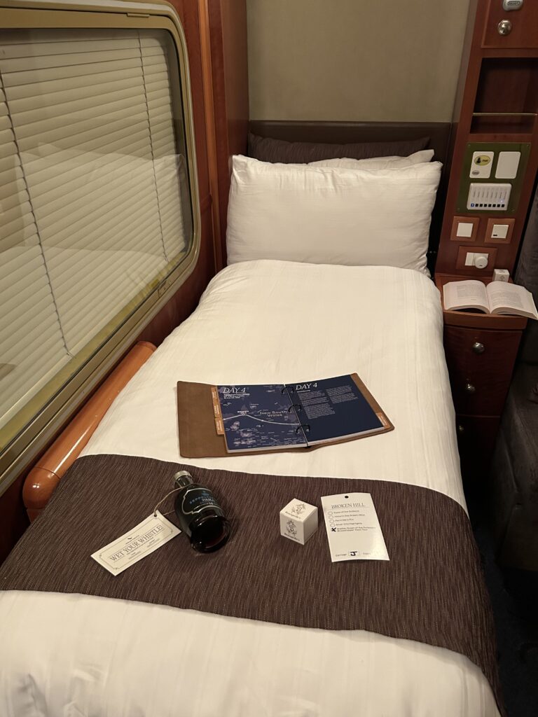 Turndown service with bed set up in the Platinum Suite onboard the Indian Pacific. 