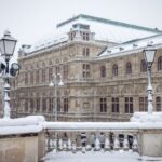 Vienna State Opera in the snow in winter, to illustrate when to go to Vienna - Luxury Escapes