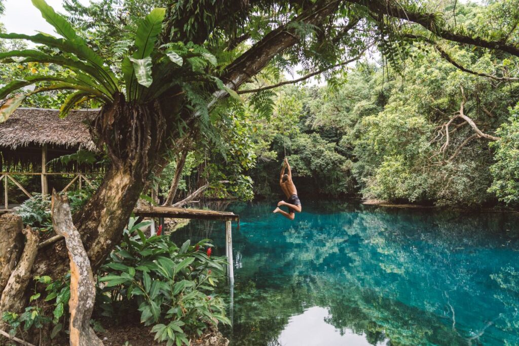 Rope swing at Matevulu, Espiritu Santo, one of the reasons to go to Vanuatu - Luxury Escapes