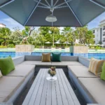 Seating by the pool at Grand Mercure Bali Seminyak - Luxury Escapes.