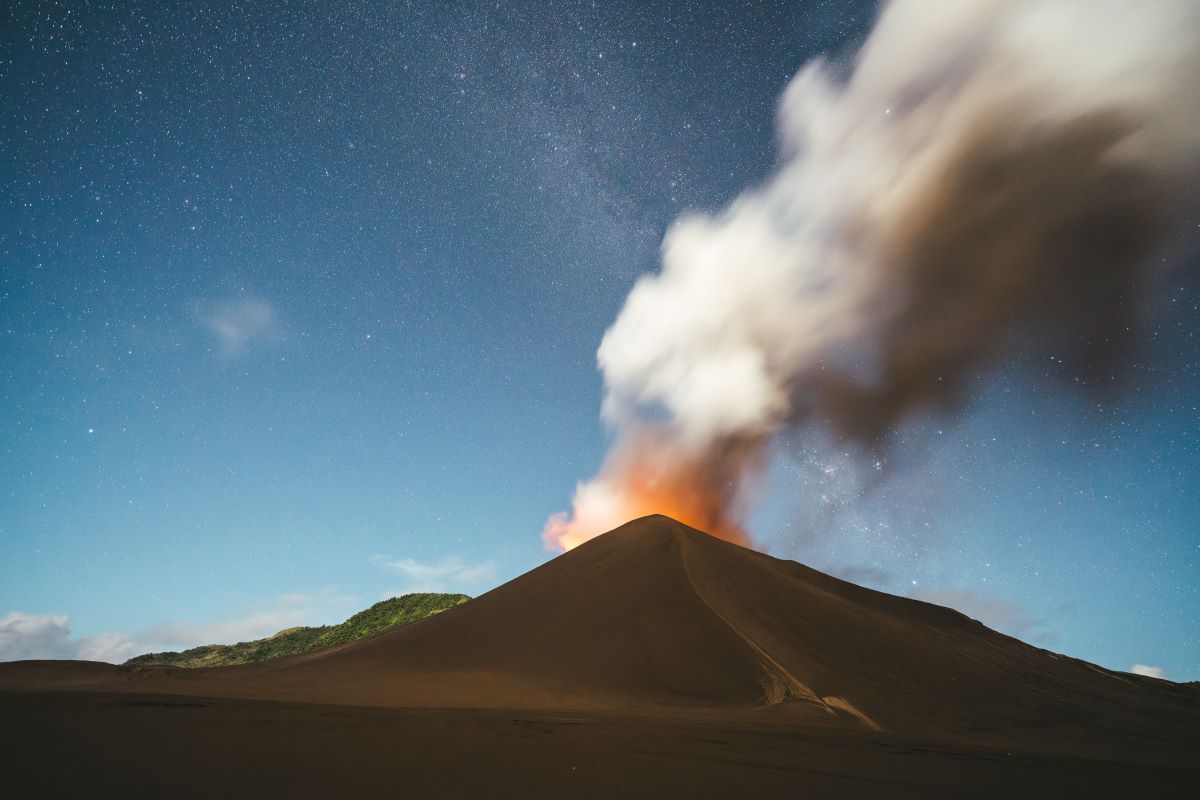 Mount Yasur, a volcano in Vanuatu. The landscapes are a reasons to go to Vanuatu - Luxury Escapes