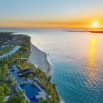 Aerial view of Hilton Fiji Beach Resort & Spa at sunset, Denarau Island - Luxury Escapes