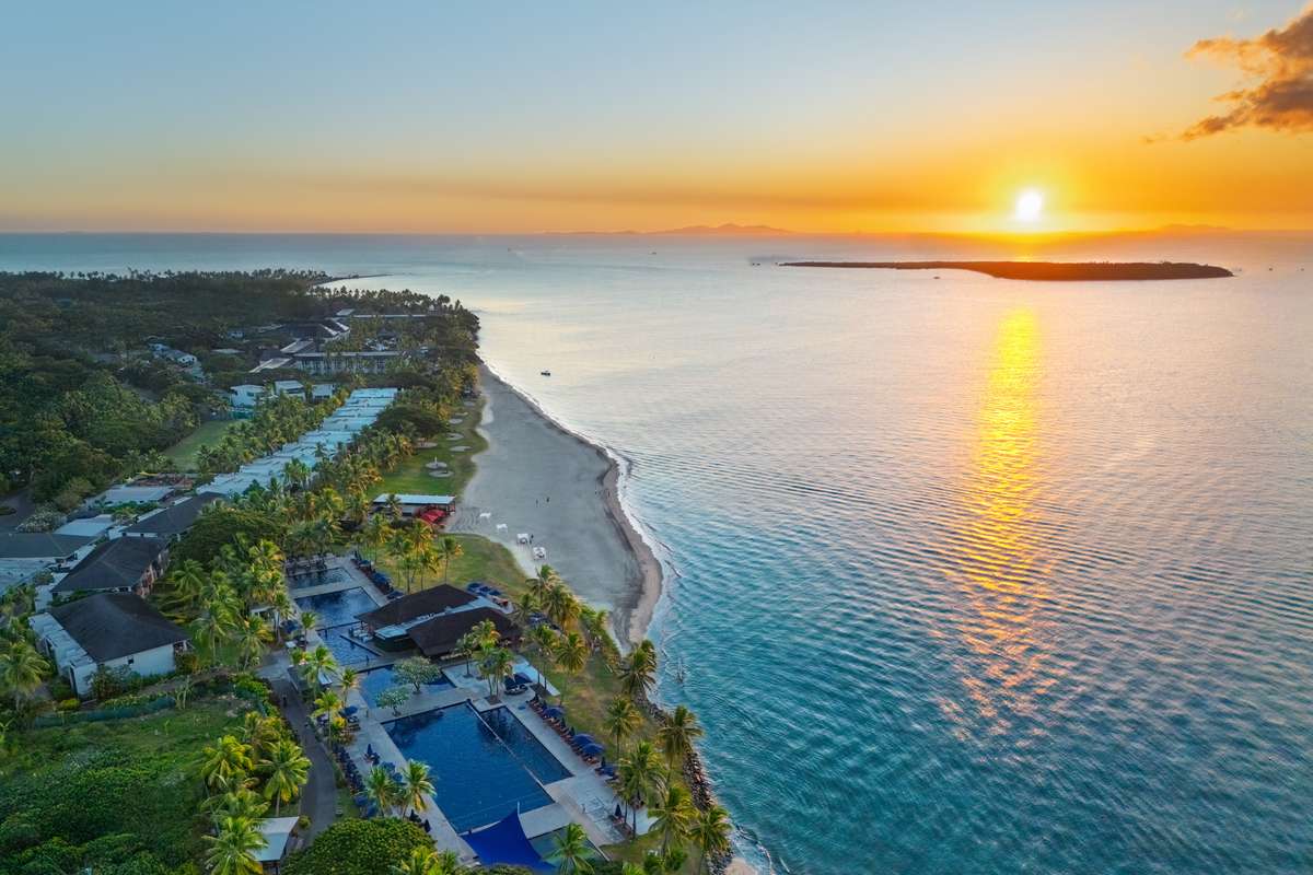 Aerial view of Hilton Fiji Beach Resort & Spa at sunset, Denarau Island - Luxury Escapes