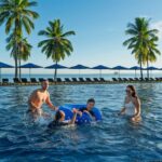 Children playing in the family pool at Hilton Fiji Beach Resort & Spa, Denarau Island - Luxury Escapes