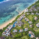Aerial shot of cliffside resort Samabe Bali Suites & Villas. Luxury Escapes.
