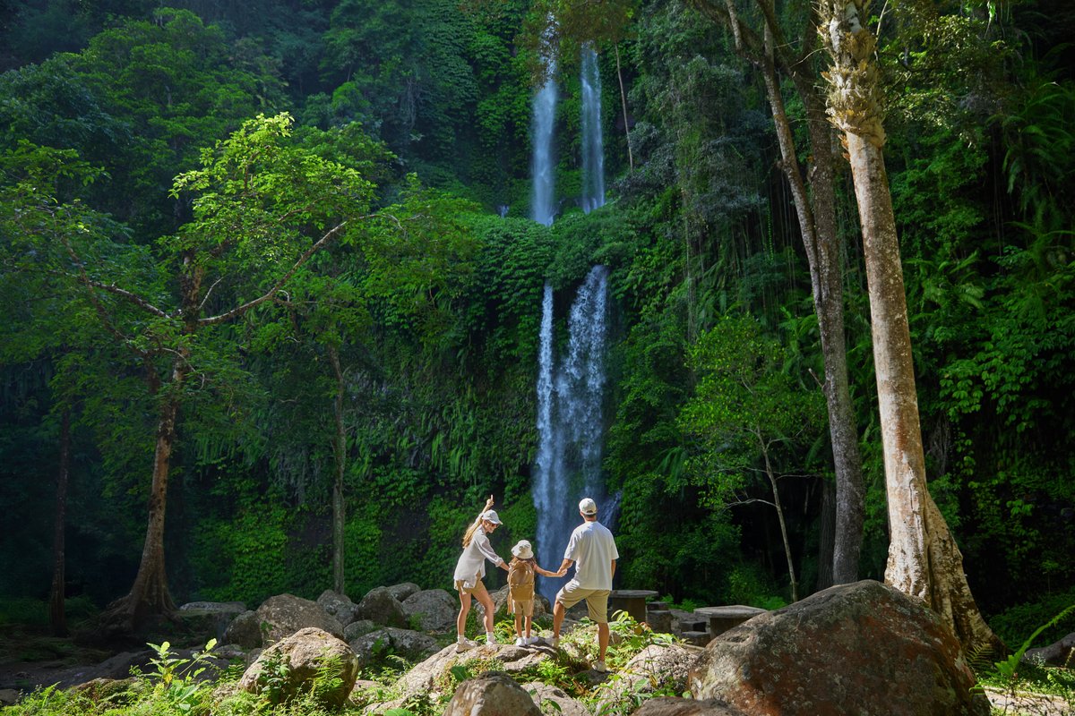 Family at Sendang Gile Waterfall near The Sira, Lombok.