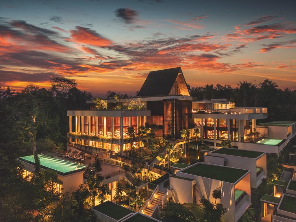 The Anantara Ubud Bali Resort at sunset showing the main dining and pool.
