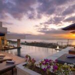 Club House rooftop pool overlooking the ocean at Bali Tropic Resort & Spa.