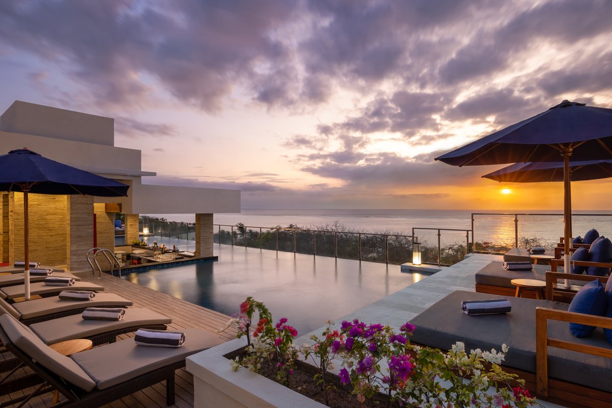 Club House rooftop pool overlooking the ocean at Bali Tropic Resort & Spa.