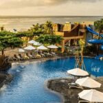 Beachfront pool with waterslides at Grand Mirage Resort & Thalasso Bali