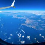 The view from an airplane window, to illustrate flight sales available on LuxPlus+ - Luxury Escapes