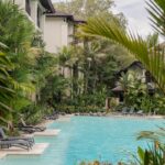 Lagoon pool surrounded by tropical gardens at Pullman Palm Cove, Queensland
