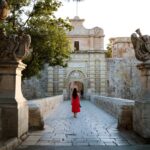 Woman walking on street in Mdina, Malta