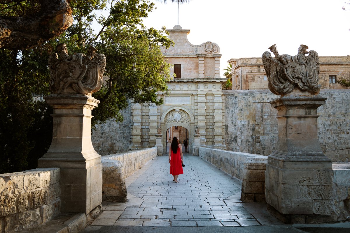 Woman walking on street in Mdina, Malta