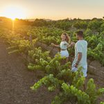 Couple running in a vineyard in Malta