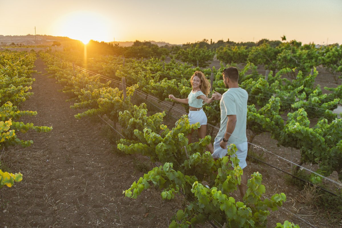 Couple running in a vineyard in Malta