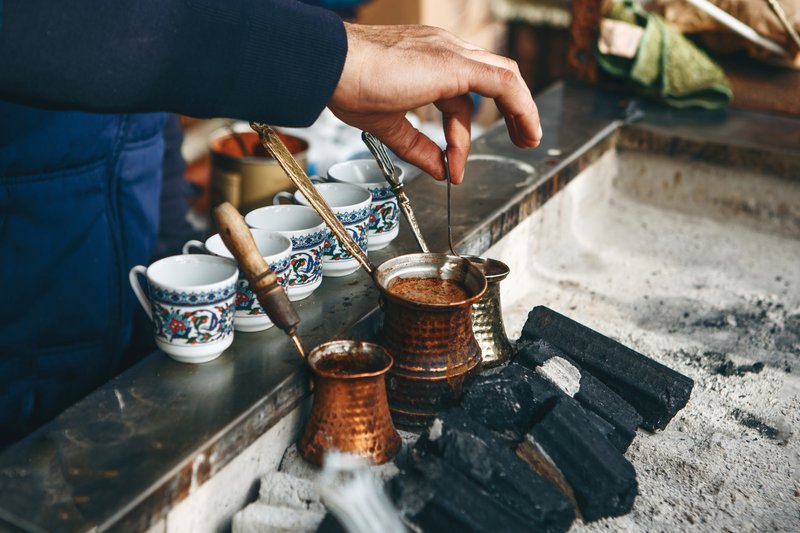 Turkish coffee prepared over hot coals