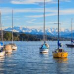 Sailboats on Lake Zurich with Alps beyond, Switzerland
