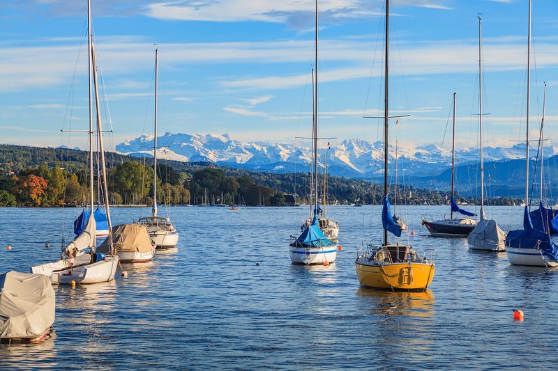 Sailboats on Lake Zurich with Alps beyond, Switzerland