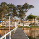 The Beachcomber Hotel & Resort beside Budgewoi Lake in Toukley at sunset - Luxury Escapes