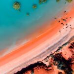 Turquoise waters and red sand in Broome, Western Australia.