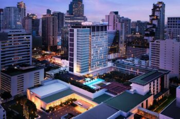 The Pullman Bangkok Stay Where a Garden-Framed Rooftop Pool Overlooks the City