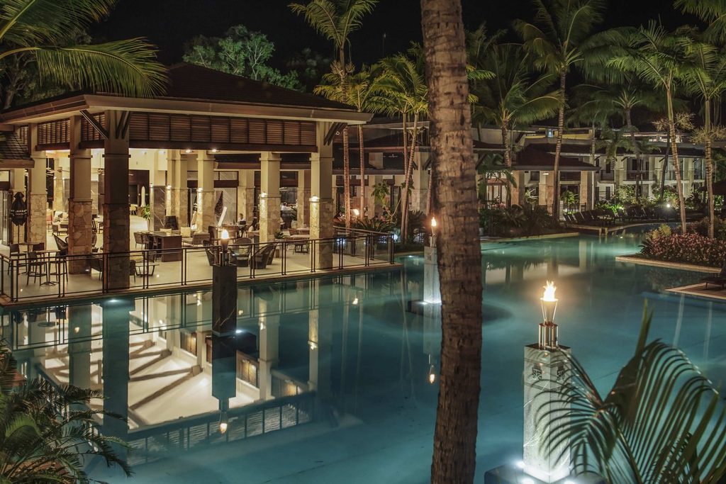 Palm-fringed hotel pool and tropical resort, Pullman Port Douglas Sea Temple Resort and Spa