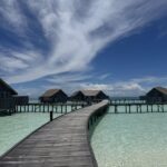 Jetty stretches toward overwater villas in the Maldives