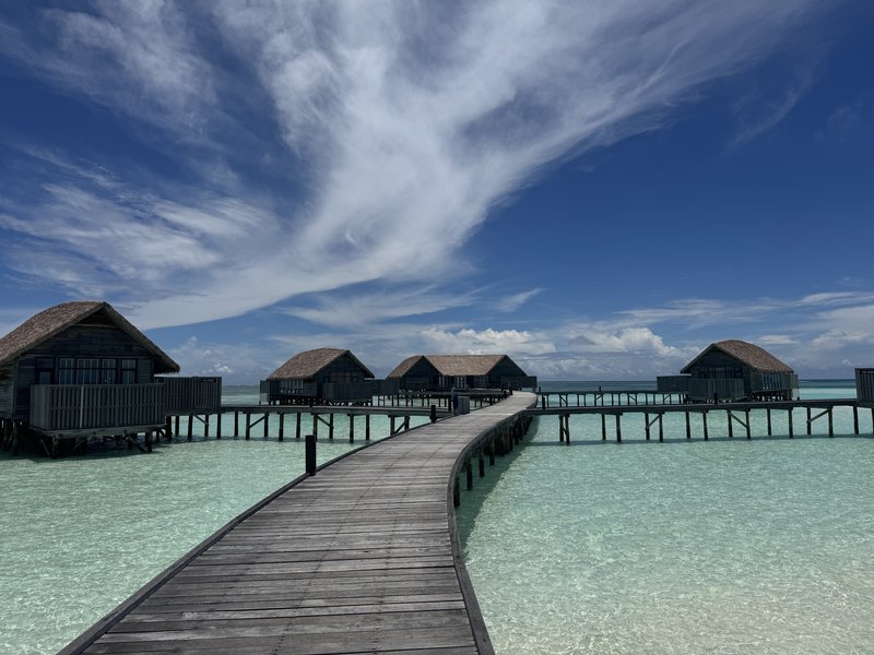 Jetty stretches toward overwater villas in the Maldives