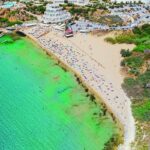 Aerial view of sandy beach and turquoise sea in Malta