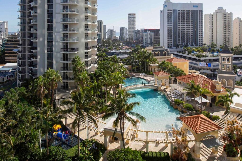 Lagoon pool surrounded by palms at Mantra Towers of Chevron, Surfers Paradise