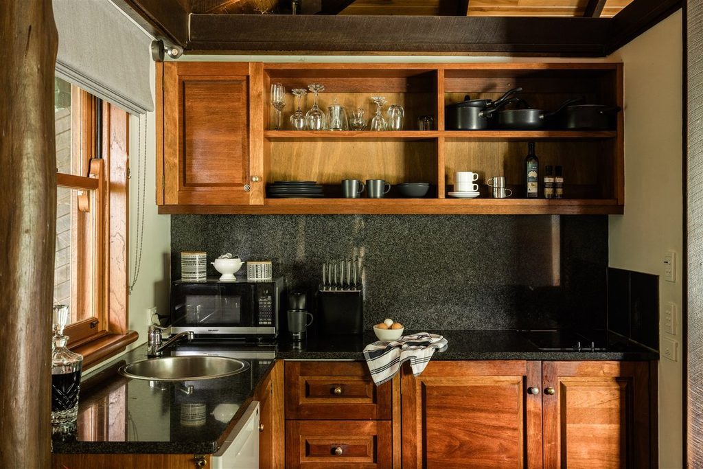 Kitchen with timber cabinets at Misty View Cottages