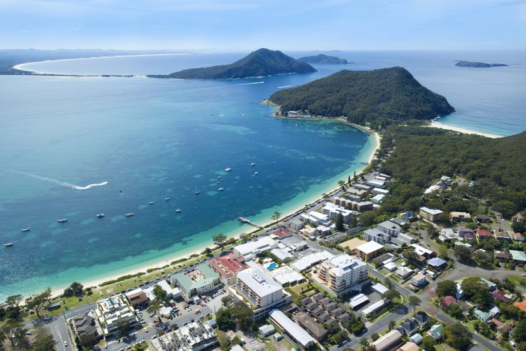 Aerial view of Shoal Bay and coastline near Ramada Resort by Wyndham Shoal Bay, NSW