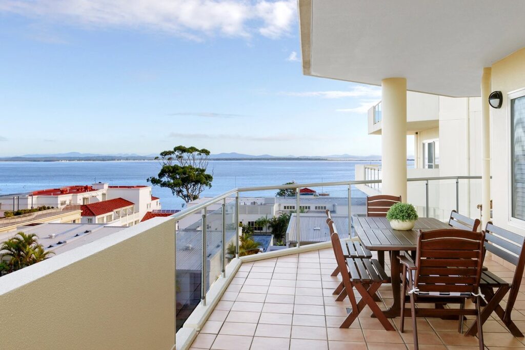 Furnished sea-view balcony at Ramada Resort by Wyndham Shoal Bay, NSW