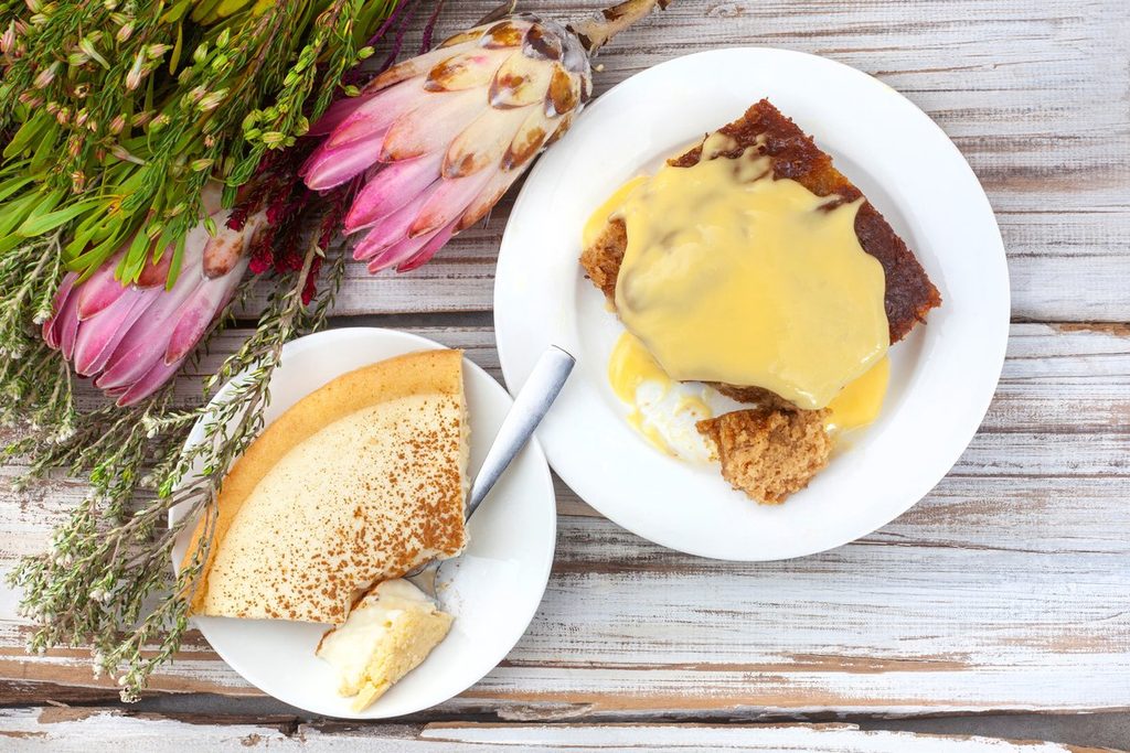 Milk tart and malva pudding on a table in South Africa