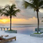 Infinity pool at sunset at The Seminyak Beach Resort & Spa, Bali